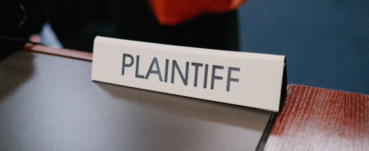 Close-up of a desk sign reading 