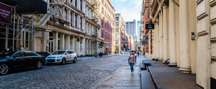 New York City, USA - June 25, 2018: Greene Street with luxury fashion retail stores in Soho Cast Iron historic District in New York City.